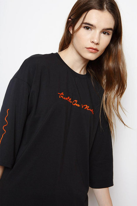 Muzca Slogan Tees In Supima Modest Loose Fitting Black T-Shirt with Oversized Fit and Orange Text