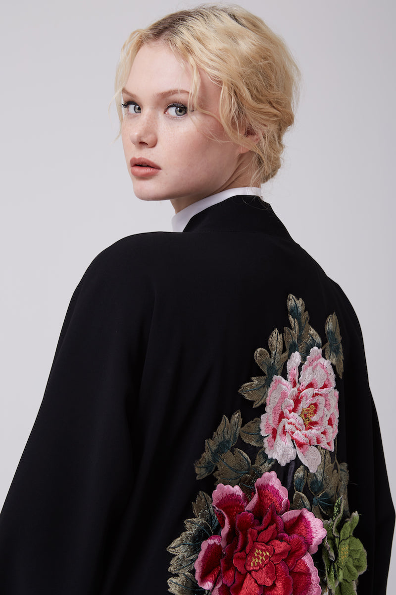 FERADJE modest black abaya or kimono with a flowery embroidery made from the finest crepe close up view