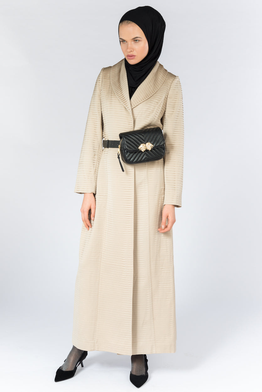 FERADJE Modest Women Royal Abaya in golden beige with collar and elegant pleated abraham fabric. It is unbuttoned and has fitted straight arms. It is design as a coat so it's perfect for any occasion and season. It can be machine washed full length view