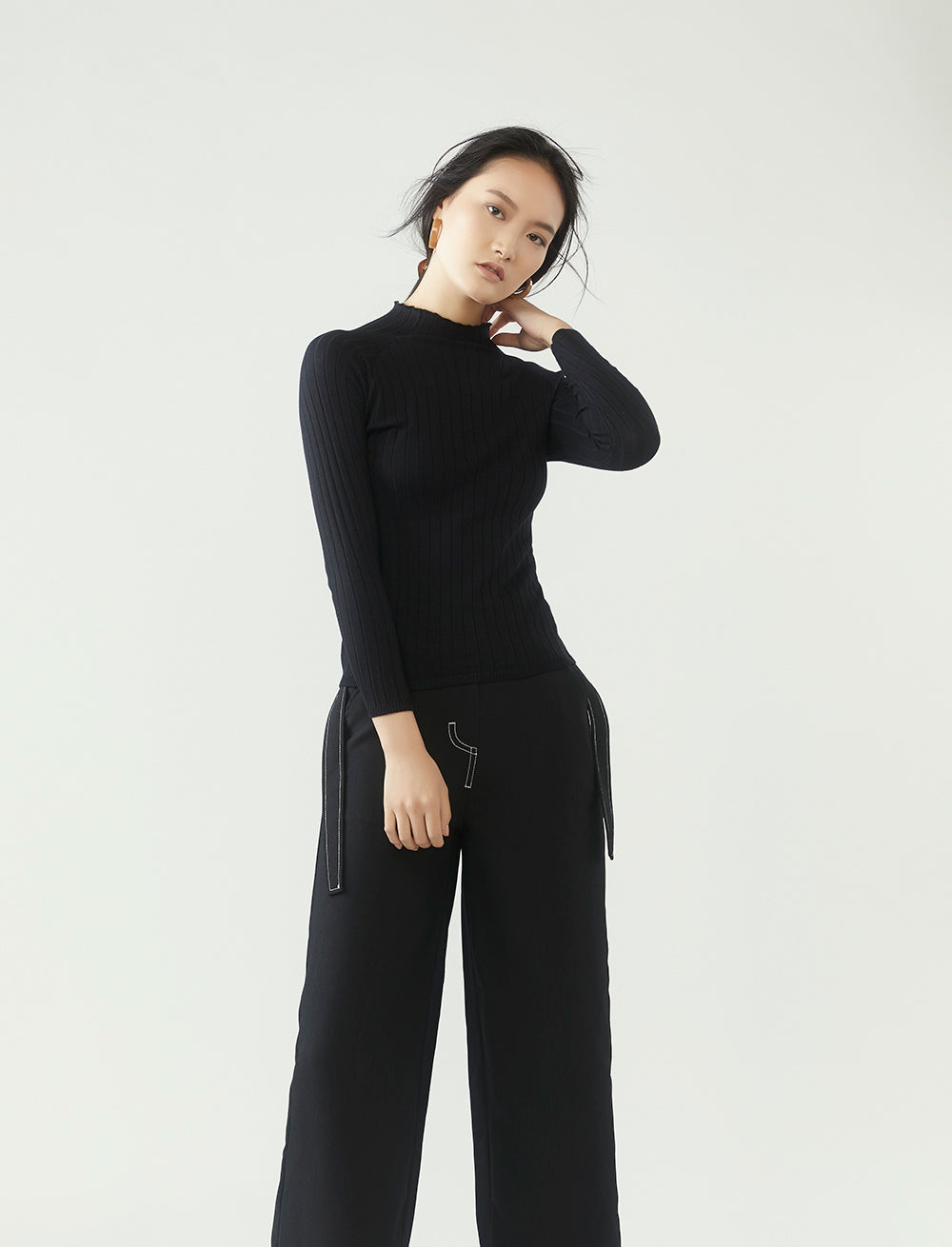 r y e  Modest Women Ribbed Knit Long Sleeve Top in Black with ribbed details and high neck collar made from 95% Viscose and 5% Spandex side view
