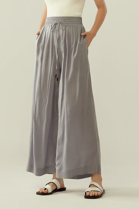 r y e Cupro Drawstring Flared Pants in Light Slate Modest Loose Fitting Ankle-Length Grey Trousers With Pockets, Elastic Waistband
