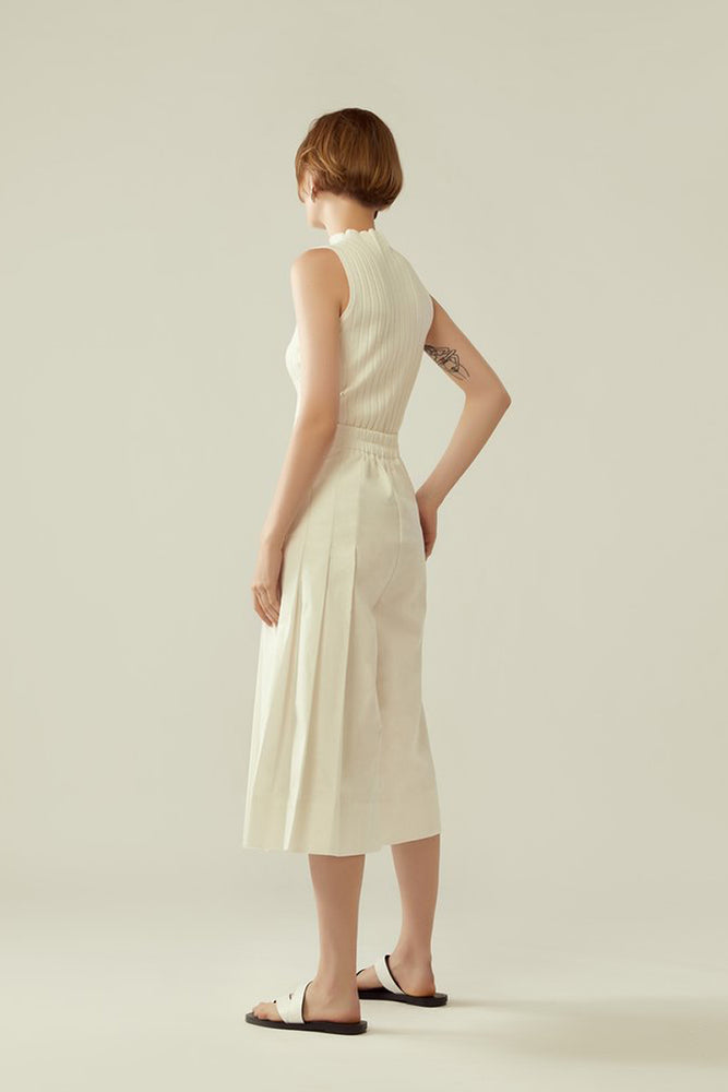 r y e Side Pleated Overlap Culottes in White Modest Wide Leg Below The Knee Trousers Asymmetrical Pleats With Pocket Gartered Back